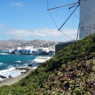 A windmill overlooking the sea in Mykonos, one of the Cyclades Islands.