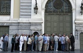 Pensioners queue outside a bank in Athens